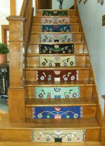 Stair Riser #3 hooked by Linda Ellis who is hooked the same pattern but different colors for each riser - looks great!